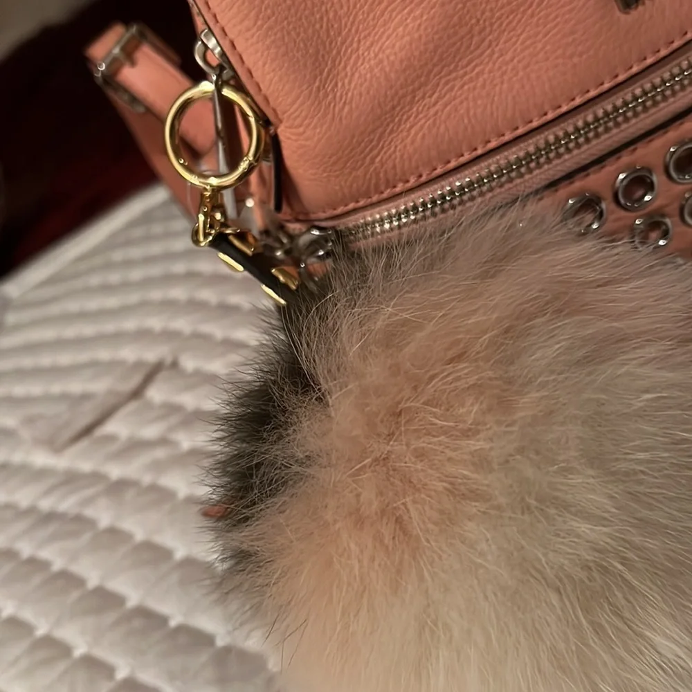 Michael Kors Rhea Medium Silver-Ringed Backpack with Fur Pompom in Coral…